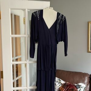 One piece navy blue jersey dress with built in bolero type jacket. Size small